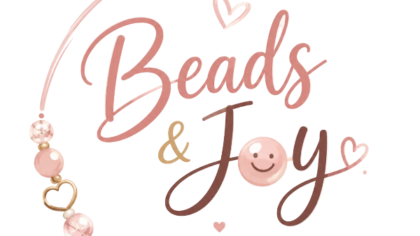 A circular logo or brand graphic reading 'Beads & Joy' with decorative pink beads, gold heart and star accents, and the phrase 'Handmade with Love' on a light cream background.